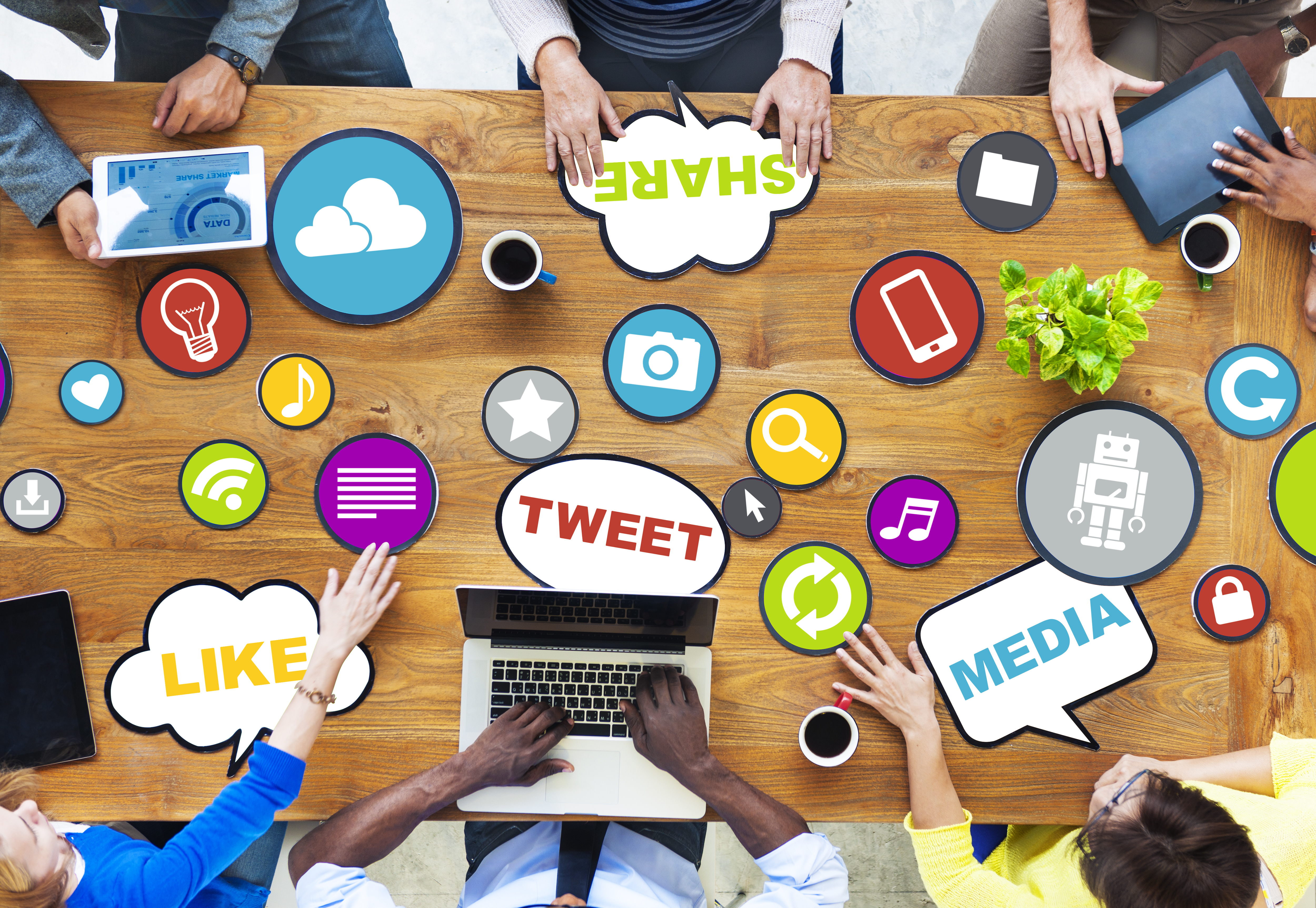 tabletop showing people
            sharing liking tweeting media in multiple forms